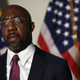 U.S. Sen. Raphael Warnock (D-GA)) speaks to members of the press after a Senate Democratic Caucus meeting on January 18, 2022, in Washington, DC.